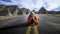 Person Laying Down on Road in Badlands National Park, South Dakota, USA