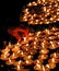 Person lights a candle during the ceremony