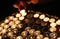 Person lights a candle during the religious ceremony