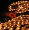 Person lights a candle during the religious ceremony