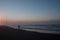 Person line fishing at Morgan Bay beach at sunset, Wild Coast, Eastern Cape, South Africa.