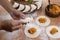 Person making Argentinian empanadas stuffed with vegetables and squash on wooden surface