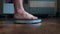Person male measures the body weight loss standing on the scale in the living room