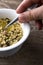 Person Mixing Delicious Acini Di Pepe Pasta with Meatballs and Spinach Italian Soup