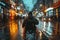 A person navigating a wheelchair through wet urban roads with vibrant city lights.