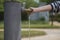 Person opens the tap of the water fountain