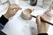 Person painting clay mug