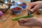 Person peeling green peas