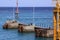 Person on peer in Padang Bai port, in Bali