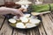 Person places slices of bread on the asparagus