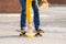 Person placing cones on the ground while riding a skateboard