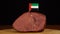 Person placing decorative UAE flag toothpicks into piece of red meat.