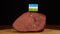 Person placing decorative Uzbek flag toothpicks into piece of red meat.