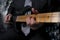 person playing gitar close up down neck