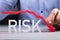 Person Pointing Diminishing Arrow Over The Risk