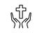 Person praying with cross in hand - concept of a devout christian worshiping Christ