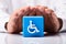 Person Protecting Cubic Block With Disabled Icon