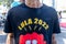 Person protesting against far-right presidential candidate Jair Bolsonaro with shirt Lula 2022