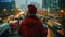 Person in red overlooking a traffic-filled urban street at night.