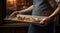 person in the restaurant with tray, person in the restaurant, close-up of hands holding tray with dishes and delicious foods