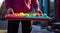 person in the restaurant with tray, person in the restaurant, close-up of hands holding tray with dishes and delicious foods