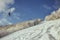 A person riding skis down a snow covered slope