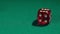 Person rolling dice on green casino table, closeup. Addiction to gambling