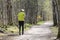 Person running on dirt path in nature