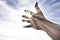 Person\'s Hand Reaching Towards Heaven Sunlight