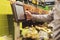 Person`s hand using touch screen monitor panel to buy some food in shop