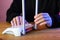 Person setting internet router antennas on wooden table