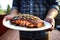 person showcasing mouthwatering apple cider glazed bbq salmon