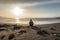 A person sitting alone on a desolate beach