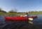 Person sitting in a canoe at the estuary looking towards two bald Eagles