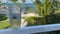 A person sitting on a lanai with a glass of beer with an aerial view of the Islands of Islamorada resort in Islamorada, Florida.