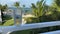 A person sitting on a lanai with a glass of beer with an aerial view of the Islands of Islamorda resort in Islamorda, Florida