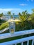 A person sitting on a lanai with a glass of beer with an aerial view of the Islands of Islamorda resort in Islamorda, Florida