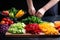 person slicing a variety of colorful fruits for salad