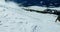 Person snowboarding on snowy mountain