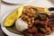 Person with spoon full of beans to put on white rice