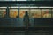 a person standing in front of an empty train