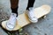 Person Standing on Skateboard Still Shot