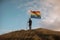 person standing on top of the hill and holding the LGBT pride flag, neural network generated photorealistic image