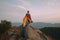 person standing on top of the hill and holding the LGBT pride flag, neural network generated photorealistic image