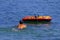 Person swimming around boat