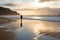 person, taking peaceful walk on golden beach, with waves rolling in