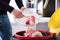 Person Throwing Cake In Trash Bin