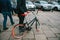 A person or a tourist rented a bicycle in the winter in street service.