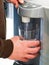 Person using water dispenser