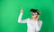 A person in virtual glasses flies in room space. Excited smiling businesswoman wearing virtual reality glasses. Woman